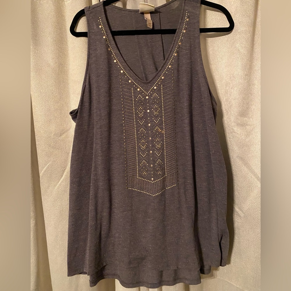 Shimmery grey flowy tank with gold embellishments.
